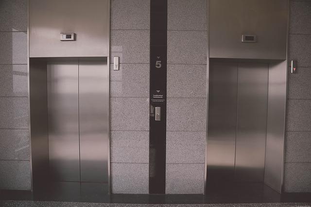 The exterior of two elevators in operation that could benefit from complimentary capital planning from Pincus Elevator Company.