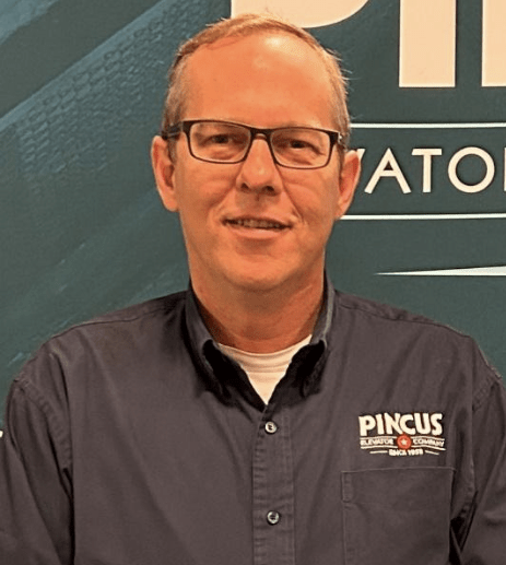 A photo of Tom Gibson, a sales rep and account manager at Pincus Elevator Company.